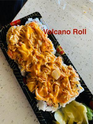 VOLCANO ROLL: In- CA, top bake seafood masago spicy mayo sauce