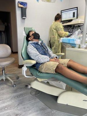 My son waiting to be treated. Great TV playing Clifford above.