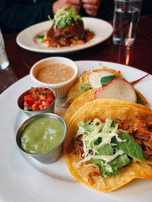 Tres Street Tacos (chicken) & Mole Enchiladas In background