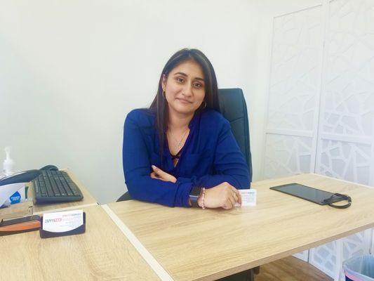 Zappy Tax Professional and Friendly representative and service provider behind the desk smiling