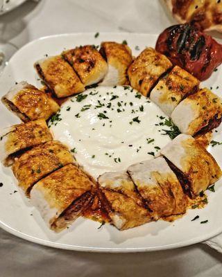 Beyti Sarma (lamb, wrapped with thin laush bread, on a bed of yogurt & butter sauce).