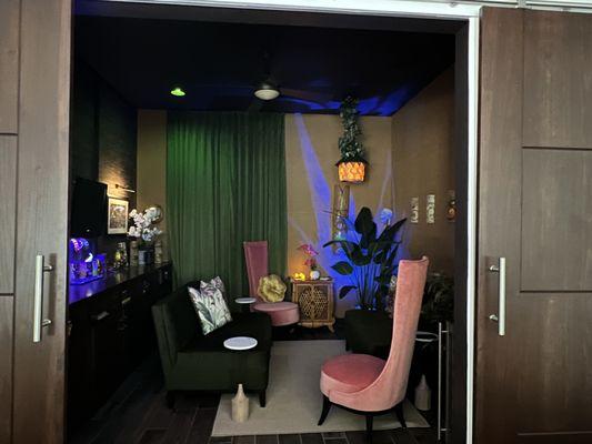 Tiki Lounge - Grasscloth wallpaper on the left, and vinyl grasscloth on the remaining walls. Custom velvet drapes & reupholstered chairs