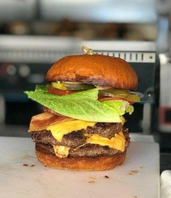 Classic double BLT burger with applewood bacon, cheese, brioche bun and special sauce