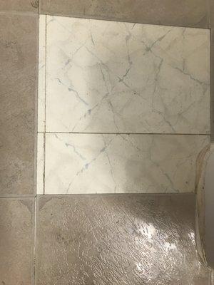 The tile lifts up when you mop don't move here