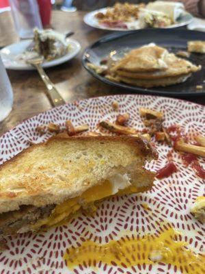 Breakfast melt, pancakes, cinnamon roll and breakfast burritos all eaten.