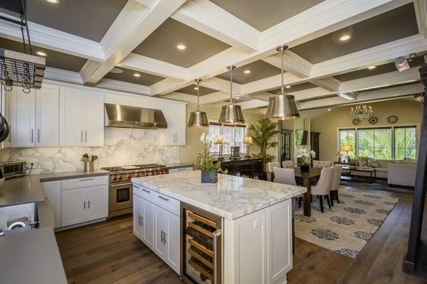 Gourmet kitchen with marble counter, SS appliances & coffered ceilings