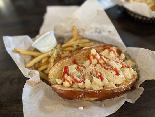 "Hansel's Heaven" traditional bratwurst on the grill pretzel roll with ketchup, piled high with creamy macaroni and cheese. YUM!