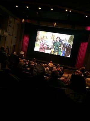 Sitting in the back of the theatre