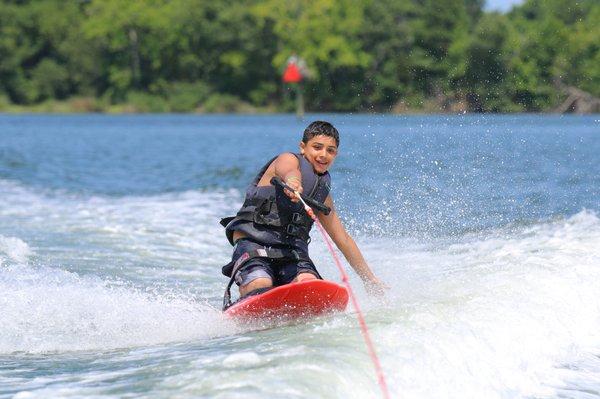 Knee-boarding is just one of the fun things kids do at camp.