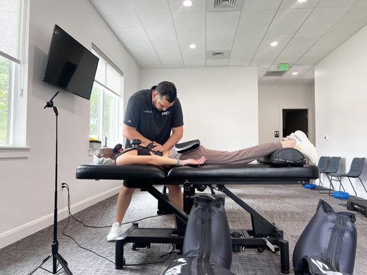 Dr Jesse doing manual therapy on a patient