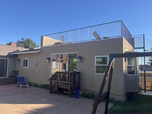 Complete new kitchen, bathroom, living space and rooftop deck. Pretty sure these people can build anything