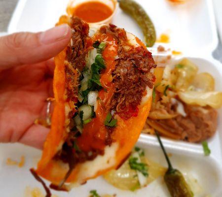 Birria with the fixins: onion, cilantro, delicious salsa