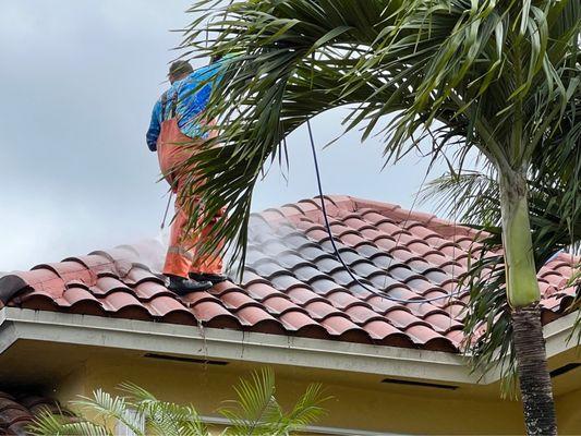 Pressure washing service on tile roof