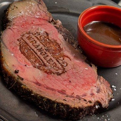 Herb Crusted Prime Rib served with buttery Yukon mashed potatoes, horseradish cream and natural beef jus