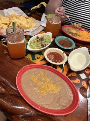 Chips and salsa were complimentary! We ordered the guac, white queso, strawberry margs, and rice and beans