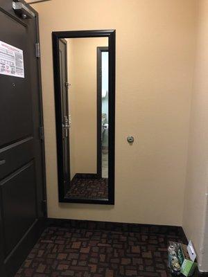 Big mirror near entrance of room