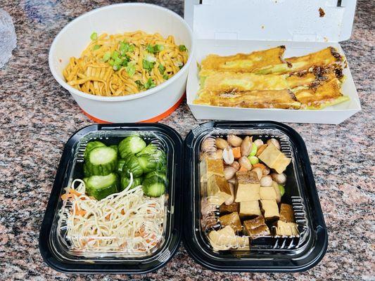 Signature noodles, veggie dumplings, boiled peanuts, tofu, tofu salad, cucumber salad