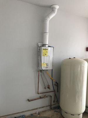 Gas line behind the water pressure tank... and water lines too...