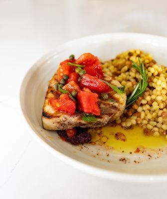 Swordfish - Buttery swordfish over Sicilian couscous & caper sauce.