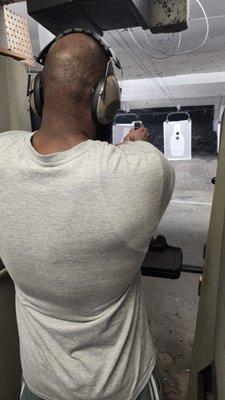 A student tightening his shot group