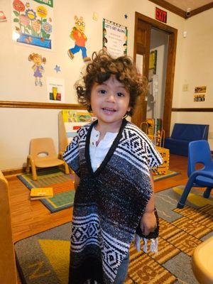 He's showing off his dress up outfit