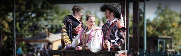 A man and two women riding on carriage!