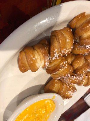 Tasty pretzel bite appetizer with cheese sauce.