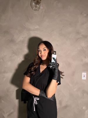 Esthetician/Business owner Malerie (holding ultrasonic scrubber)