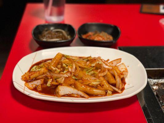 Tteokbokki (tuk-bow-kee) Korean Rice Cake. If you haven't had it before, it's like a savory mochi or maybe a gnocchi in a spicy sauce.