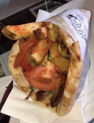 Gyro wrap: served in Greek pita wrap with lettuce, tomatoes, onions, cucumbers, a sprinkle of paprika and fries inside.