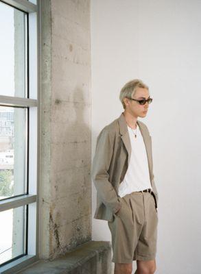 Pleated Short in Vintage Washed Putty Twill, Sleeveless T-Shirt in White Knit Crepe, and our Double Breasted Lab Blazer in Putty