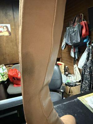 Large black stains from shoe dye. This is a photo after he tried to fix the problem.