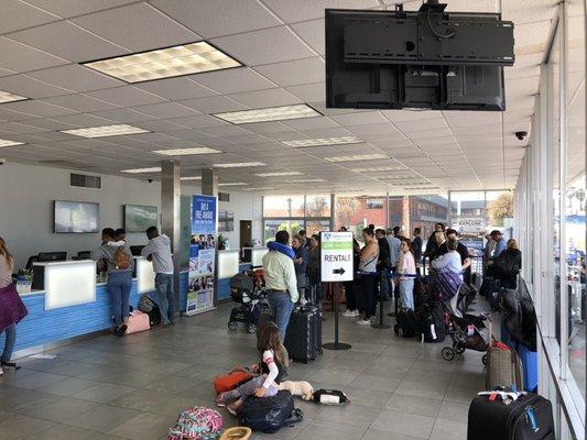 The line in here keeps wrapping around and barely moves! No air and not enough employees!