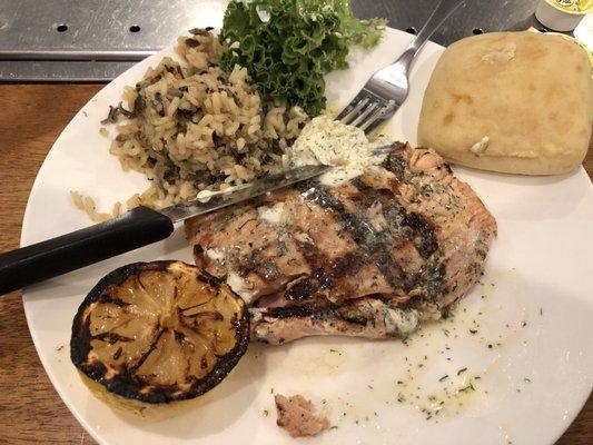 Grilled salmon with seasoned butter and wild rice.