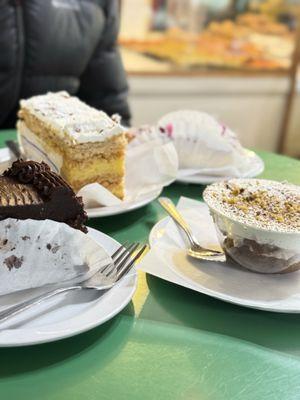 Chocolate cake, pistachio tiramisu, mixed fruit cake, and napoleon