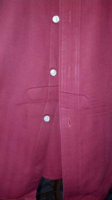 Creases pressed into the shirt by their machine.