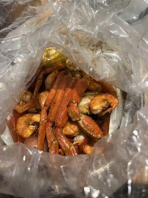 Snow Crab Legs, Headless Shrimp, Lobster Tails, Corn, Potatoes (Weekender Special) in The Juicy Seasoning, Mild.