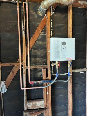 Electric Tankless water heater.
Replaced traditional gas Tank water heater.