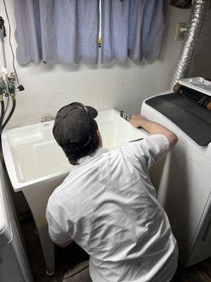 Install utility laundry sink