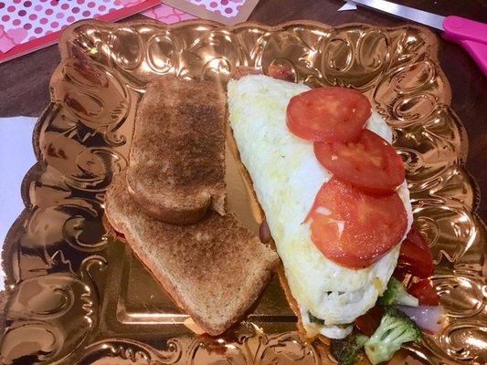 Egg white omelette stuffed with grilled veggies. (Only one piece toast because I requested it that way)