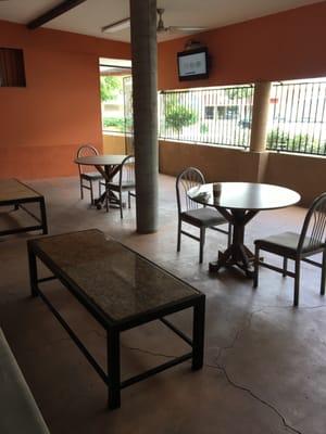 Outdoor Seating area wit a flat screen