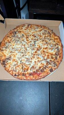 Large hamburger and mushroom pizza with extra cheese