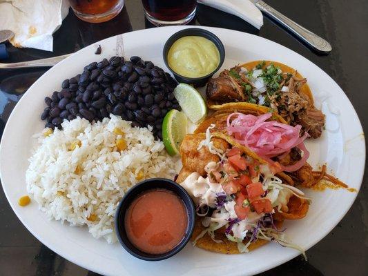 Taco plate with carnitas, COCHINITA PIBIL, and shrimp.