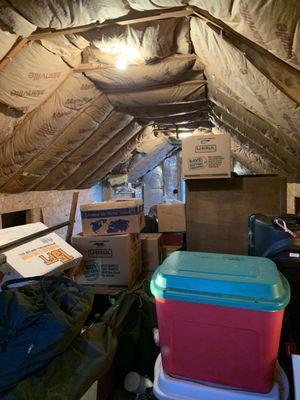 This is a before photo of a loft renovation into a painting and relaxing space.