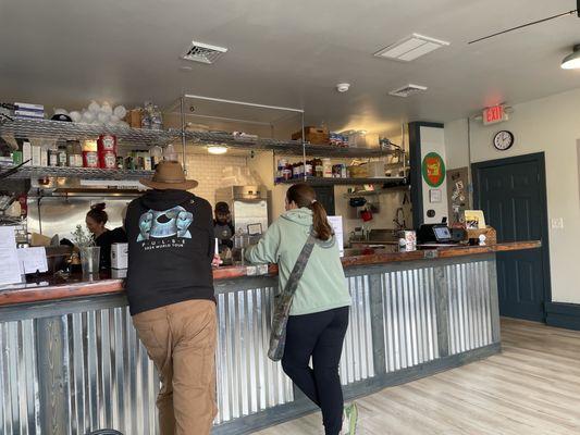 Interior, folks waiting at the counter