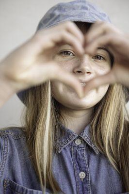 Kids Portrait making a heart shape with the hands