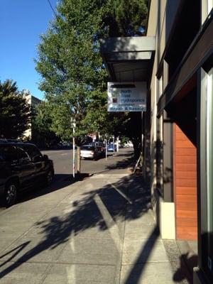 From the sidewalk on the south side of Burnside.