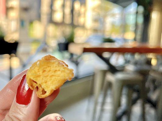 Cheese Curds. Small, irregularly-shaped chunks of cheese, battered and fried. The flavor is milky and mildly salty.