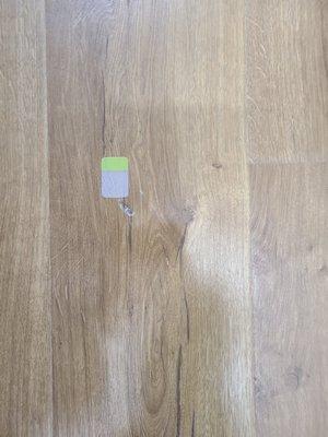 Another flaw appear in different area in the flooring in the kitchen.  It was a total of 4 different areas.