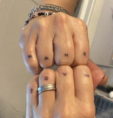 HAND MADE knuckle tattoos with small letters done by Tony Soto at Classic Tattoo